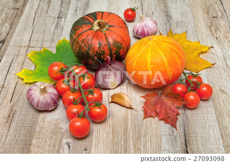 pumpkin and other vegetables on a wooden table pumpkin and other vegetables on a wooden table 27093098