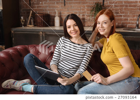 Positive delighted cousins looking at camera 27093164