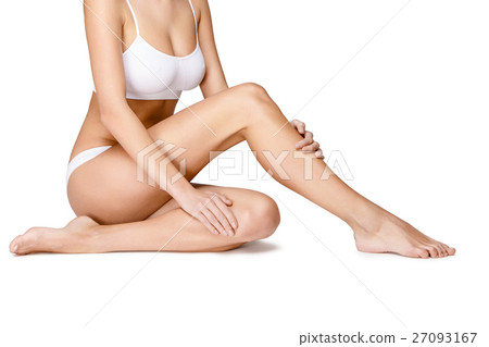 Long pretty woman legs isolated on white 27093167