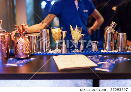 Barman show. Bartender is making cocktail at night Barman show. Bartender is making cocktail at night 27093897