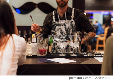 Barman show. Bartender is making cocktail at night Barman show. Bartender is making cocktail at night 27093899