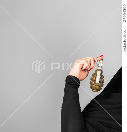 Hand grenade in a woman's hand Hand grenade in a woman's hand 27094500