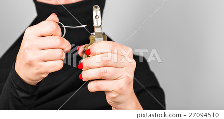 Hand grenade in a woman's hand with the pin pulled Hand grenade in a woman's hand with the pin pulled 27094510