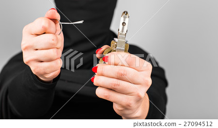 Hand grenade in a woman's hand with the pin pulled Hand grenade in a woman's hand with the pin pulled 27094512