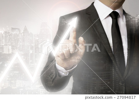Businessman with city background showing stock market Businessman with city background showing stock market 27094817