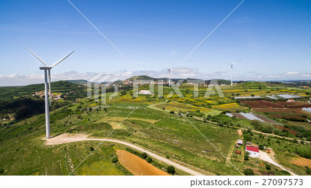 Wind power plants on a green hills aerial drone 27097573
