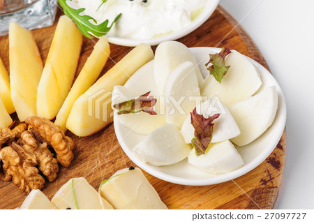Assorted cheeses and wallnuts Assorted cheeses and wallnuts 27097727