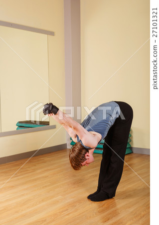 Man stretching the shoulder joint Man stretching the shoulder joint 27101321