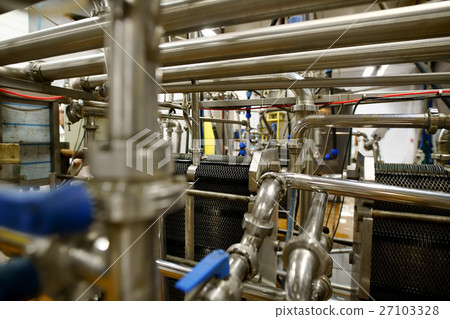 Dairy plant equipment at work close up shot Dairy plant equipment at work close up shot 27103328