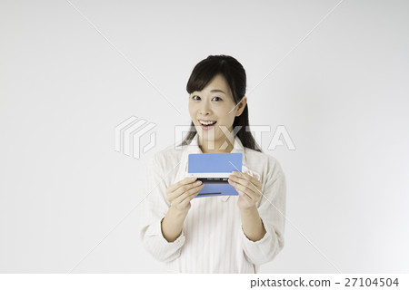 A woman looking at a passbook A woman looking at a passbook 27104504