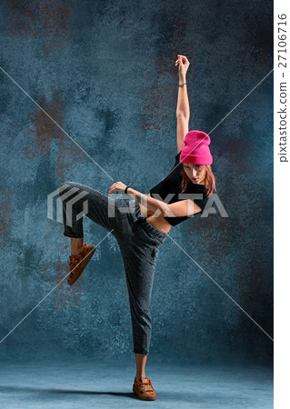 Young girl break dancing on wall background. Young girl break dancing on wall background. 27106716