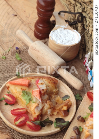 Italian pizza is delicious on wood background. Italian pizza is delicious on wood background. 27110437
