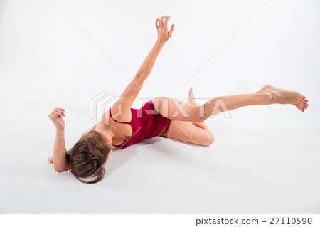Young beautiful dancer in beige dress dancing on Young beautiful dancer in beige dress dancing on 27110590