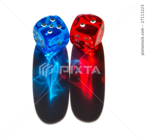 Two tiny translucent plastic dice with long shadow Two tiny translucent plastic dice with long shadow 27111223