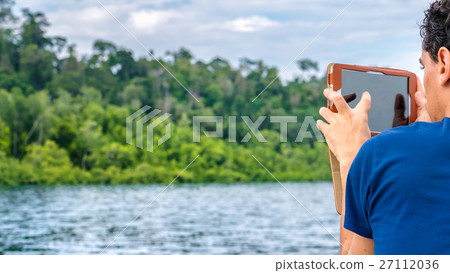 Traveler making Foto with Gadget, Kabui Bay, Ampat Traveler making Foto with Gadget, Kabui Bay, Ampat 27112036