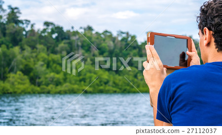 Traveler making Foto with Gadget, Kabui Bay, Ampat Traveler making Foto with Gadget, Kabui Bay, Ampat 27112037