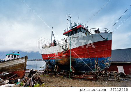 Boat on a coast. Moored boat on a pier. Boat on a coast. Moored boat on a pier. 27112416