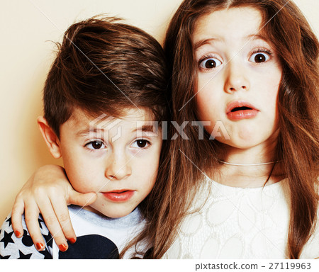 little cute boy and girl hugging playing on white 27119963