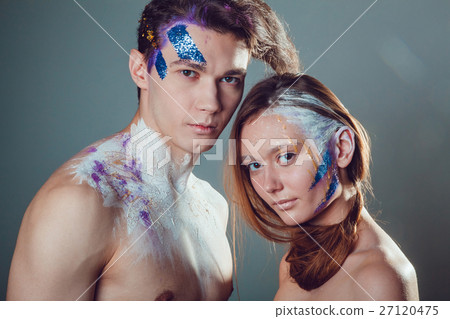 Fashion young man and woman with creative face art Fashion young man and woman with creative face art 27120475
