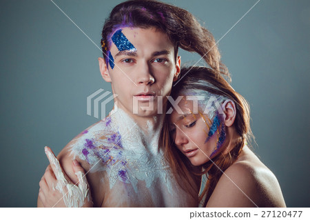 Fashion young man and woman with creative face art Fashion young man and woman with creative face art 27120477