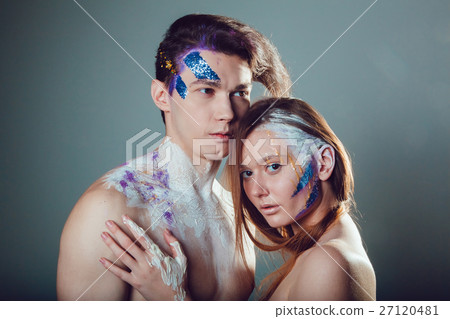 Fashion young man and woman with creative face art Fashion young man and woman with creative face art 27120481