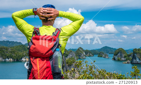 Traveler enjoy the View over Kabui Bay, Raja Ampat 27120913
