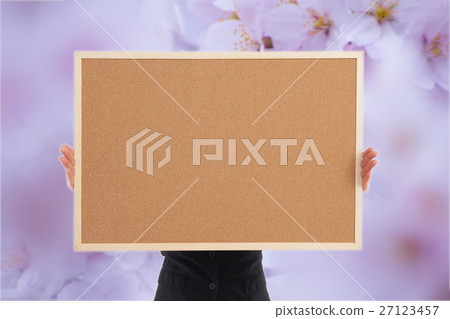 Woman with corkboard / no face / cherry blossoms Woman with corkboard / no face / cherry blossoms 27123457