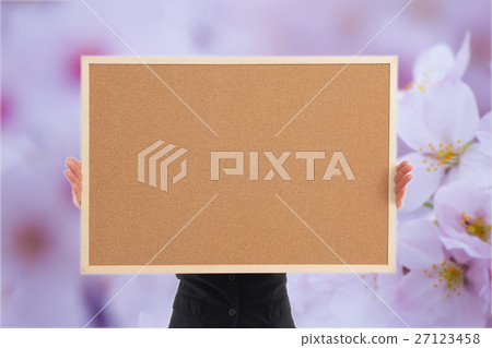 Woman with corkboard / no face / cherry blossoms Woman with corkboard / no face / cherry blossoms 27123458