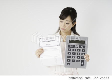 A woman looking at insurance policy A woman looking at insurance policy 27123543