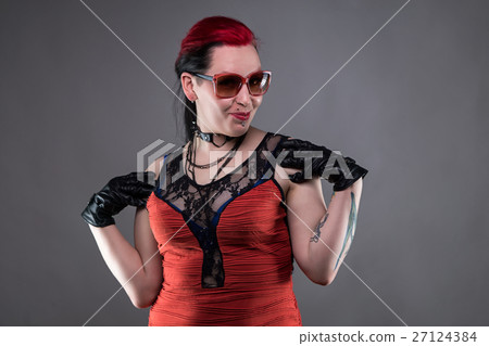 Posing rock woman in red dress Posing rock woman in red dress 27124384