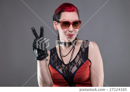 Rock woman showing peace sign 27124385