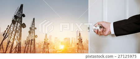 Businessman open door,with telecommunication tower Businessman open door,with telecommunication tower 27125975