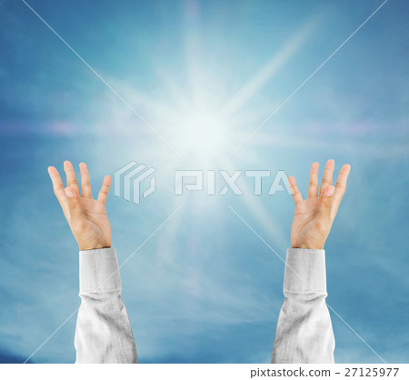 Hand trying to reach on the sky with sunshine rays 27125977