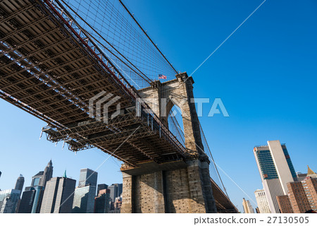 Skyscrapers in New York and the Brooklyn Bridge during the day 27130505