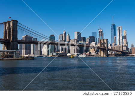 Skyscrapers in New York and the Brooklyn Bridge during the day 27130520