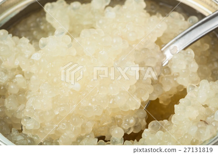 salty white caviar of halibut with spoon in tin 27131819