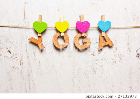 the word "yoga" from the wooden letters 27132978