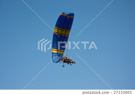 paraglider with a motor in sky paraglider with a motor in sky 27133005