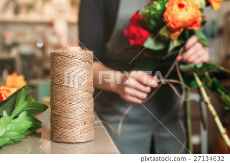 Florist work at flower shop. 27134632