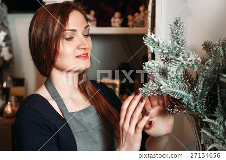 Woman with pine branch Woman with pine branch 27134656