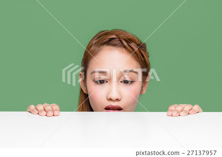 A girl looking into the white table 27137957