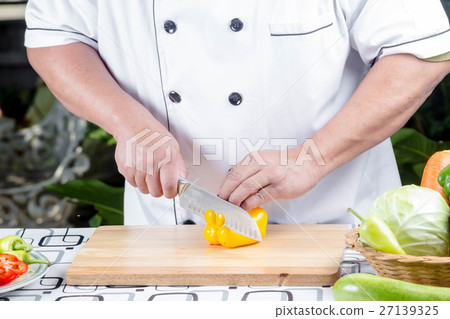 Chef cutting tomato Chef cutting tomato 27139325