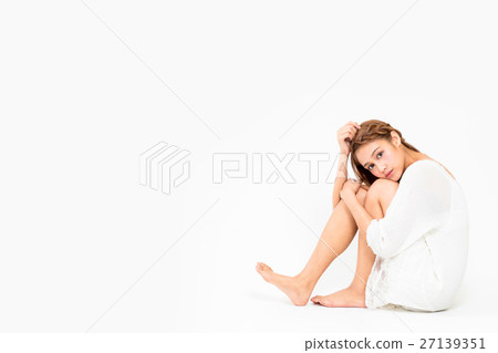 A girl sitting on the floor 27139351