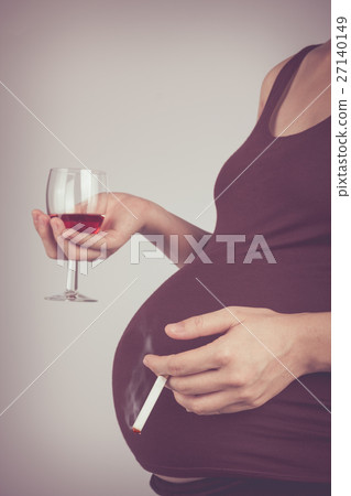 Pregnancy with cigarette and alcohol. Unhealthy. Pregnancy with cigarette and alcohol. Unhealthy. 27140149