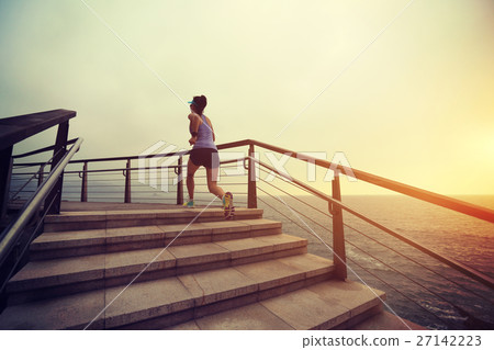 fitness woman trail runner running on seaside 27142223