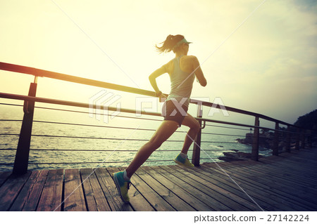 fitness woman trail runner running on seaside 27142224