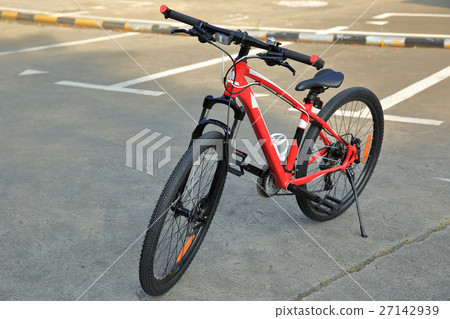 closeup of mountain bike at parking lot 27142939