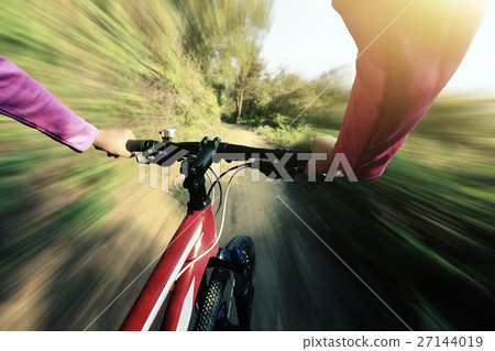 riding mountain bike on forest trial 27144019