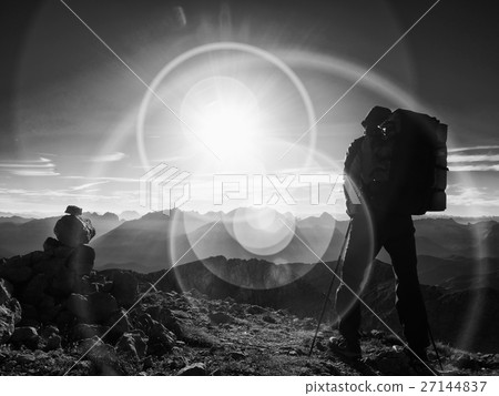 Silhouette of man with backpack and poles in hand 27144837