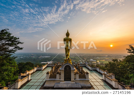 Buddha standing on a mountain in morning Buddha standing on a mountain in morning 27145196